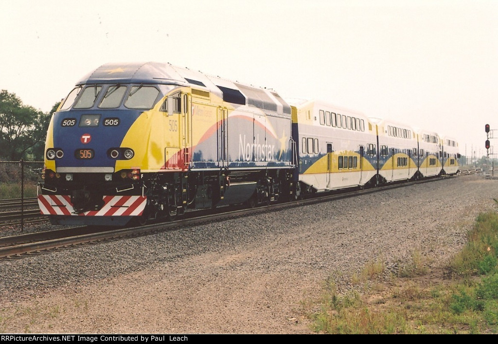 Test train eases east out of the station